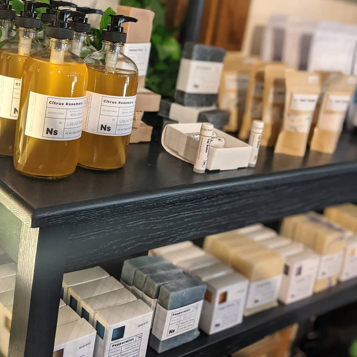 A store display with soap lined up in rows